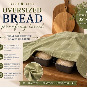 May include: An oversized sage green bread proofing towel with thin white vertical stripes, made of 100% cotton. The towel measures 35 inches by 35 inches and features a small white fabric tag labeled Little Hill Homestead in the bottom corner.