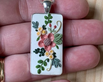 Beautiful one of a kind Necklace - dainty pink daisy bouquet with lots of vines and leaves. Background of white causes the flowers to pop.