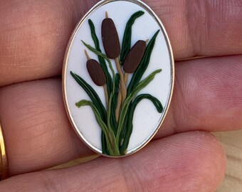 Botanical Clay Necklace - cattails. Simple style on a lovely oval pendant. White background so the design pops out.