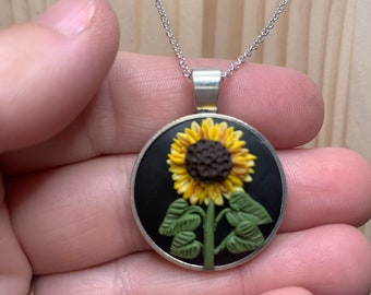 Handmade Necklace - sunflower with tons of detailed petals. Lovely black background makes it really pop while be worn.