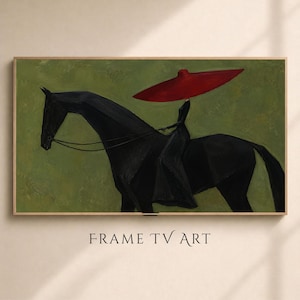 Op de afbeelding: Een rechthoekige digitale print getiteld FRAME TV ART met een schilderij van een zwart paard met een ruiter in een lange zwarte jurk en een rode hoed met brede rand. De achtergrond is olijfgroen en het kunstwerk is ingelijst in hout.