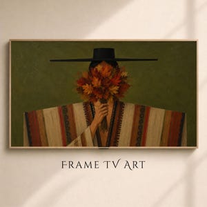 May include: A rectangular digital art print for a television screen featuring a person wearing a wide-brimmed black hat and a striped poncho, holding a large bouquet of vibrant orange, red, and yellow autumn leaves that obscures their face.