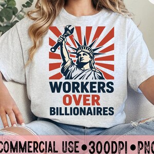May include: A light grey t-shirt with a graphic of the Statue of Liberty holding a wrench, set against a red and white burst design. The text "WORKERS OVER BILLIONAIRES" is printed below the image.