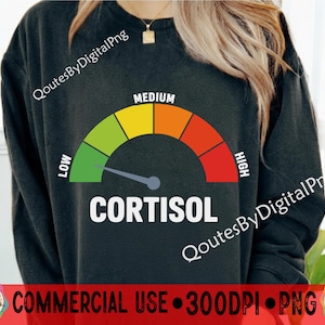 May include: Dark grey sweatshirt featuring a cortisol level gauge. The gauge ranges from low to high, with the needle indicating a low level. The word "CORTISOL" is printed in white below the gauge.
