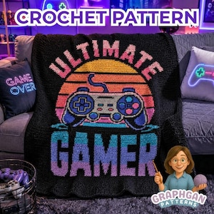 Peut inclure: Une couverture en crochet noir présentant un motif graphique coloré de manette de jeu vidéo centré sur un design de coucher de soleil. Le texte ULTIMATE GAMER est affiché en lettres grasses au-dessus et en dessous de la manette.