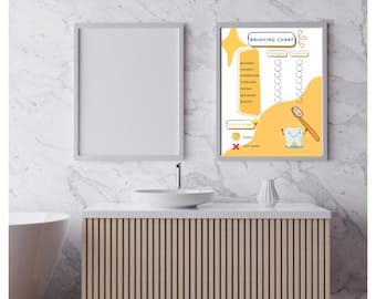 May include: A framed "Brushing Chart" poster with a yellow and white design hangs on a marble wall. The chart includes a tooth graphic, a toothbrush, and a checklist for each day of the week. A blank framed poster is next to it.