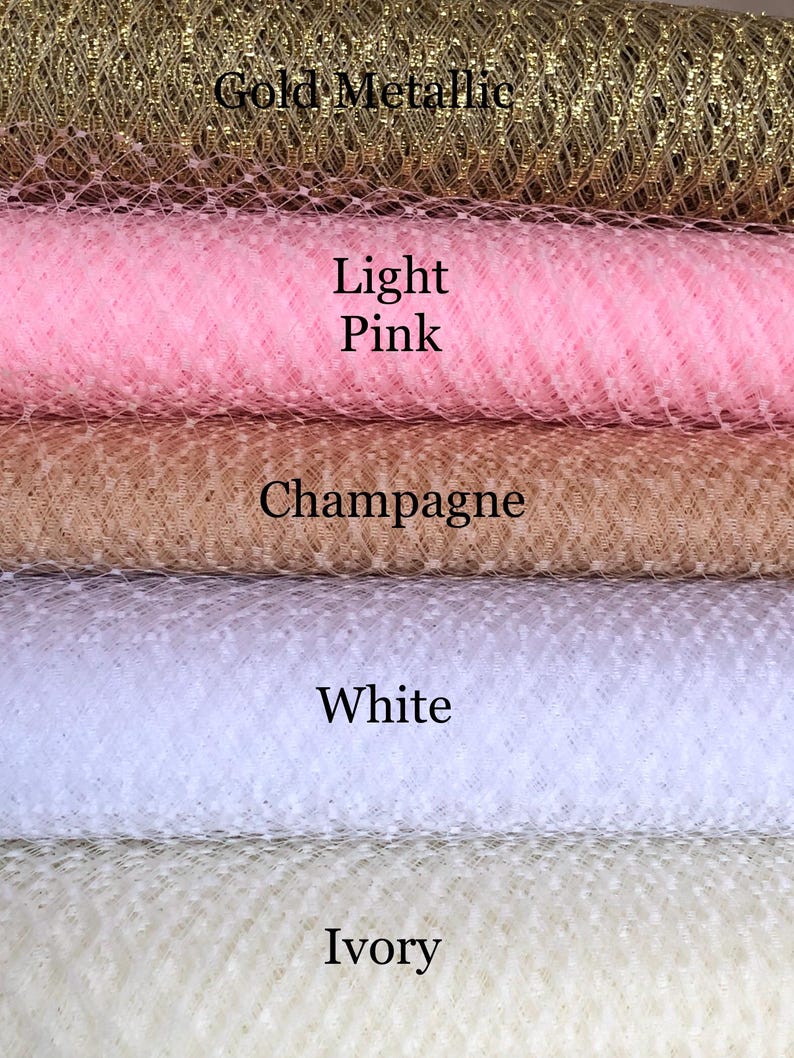 May include: Five different colors of tulle fabric, from top to bottom: gold metallic, light pink, champagne, white, and ivory.
