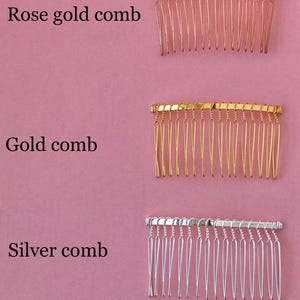 May include: Three hair combs in different colors: rose gold, gold, and silver. Each comb has a curved shape and multiple teeth.