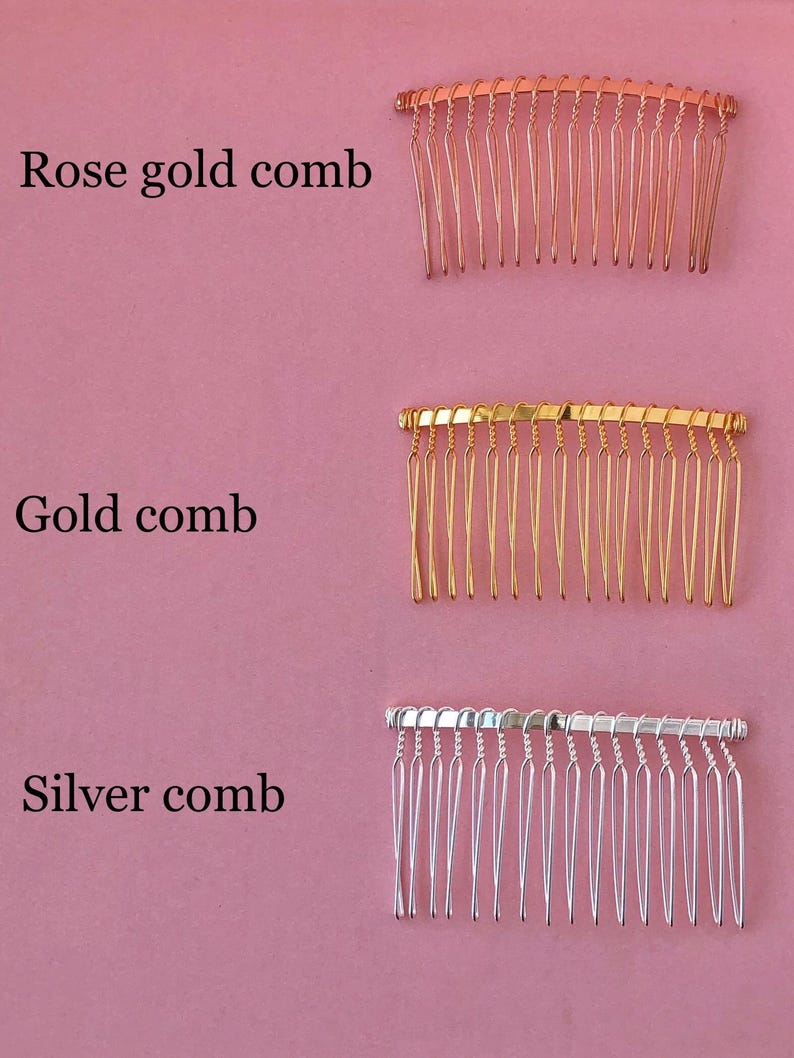 May include: Three hair combs in different colors: rose gold, gold, and silver. Each comb has a curved shape and multiple teeth.