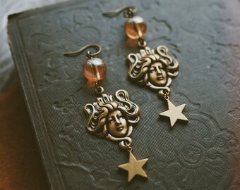 floating on stars. a pair of vintage inspired bohemian celestial golden aura quartz, lady, and star earrings