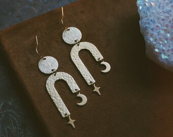 retrograde. a pair of bohemian celestial gold brass geometric arch earrings