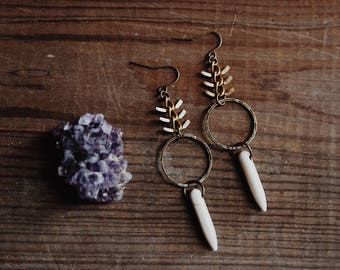 wilderness calling. a pair of fishbone and howlite dangle hoop earrings.