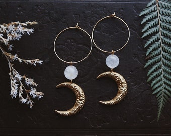 moon aura. a pair of celestial bohemian aura quartz and floral brass moon hoop earrings