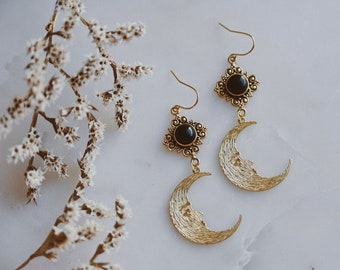 lucina. a pair of bohemian celestial onyx stone and golden crescent moon face earrings