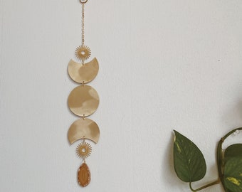 divya. a bohemian celestial agate moon phase and sun wall hanging