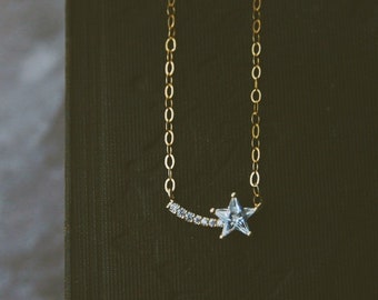 shooting star. a bohemian dainty celestial cubic zirconia gold shooting star necklace