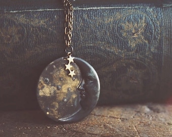 la luna necklace in dark patina. a bohemian crescent moon face and star constellation statement necklace