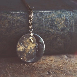 la luna necklace in dark patina. a bohemian crescent moon face and star constellation statement necklace