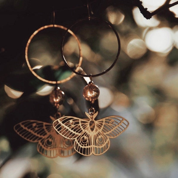hermione. a pair of golden aura quartz and moth hoop earrings