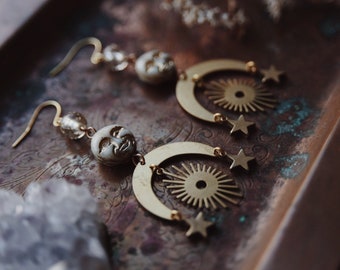 celestial rays. a pair of boho glass moon face, vintage star bead, sunburst and star earrings