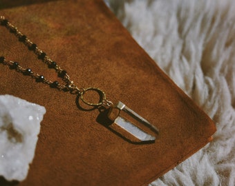 nova. a bohemian black onyx, gold pyrite, and quartz statement necklace