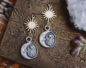 cosmos. a pair of mixed metal celestial boho sun moon and star earrings