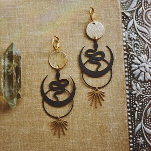 shadow serpent. a pair of bohemian mixed metal black snake earrings