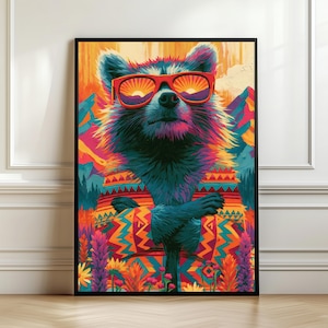 May include: A framed wall art print featuring a stylised raccoon wearing bright red sunglasses with a sunset reflection. The raccoon is dressed in a colourful patterned sweater against a vibrant background of mountains, orange skies, and wildflowers.