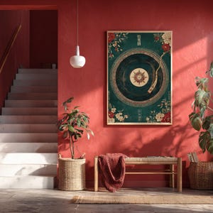May include: A framed wall art print featuring a vintage record design with floral accents in red, white, and gold against a teal background. The artwork includes Asian-inspired text and is displayed on a red wall.