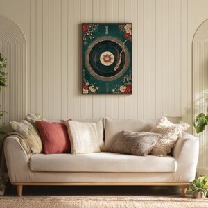 May include: A framed wall art print featuring a vintage record player design with a teal background and floral accents. The artwork is displayed above a beige sofa with various throw pillows. The room has a neutral color palette.