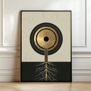May include: Abstract art print featuring a gold and black circular design with a tree-like structure and roots. The artwork is framed in a black border, with a beige and black background. The design is modern and minimalist.