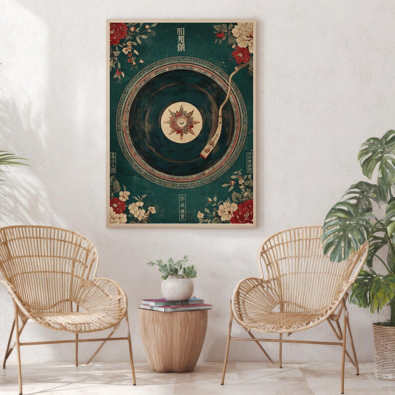 May include: A framed art print featuring a vintage-style record player design. The artwork has a teal background with floral accents in red and cream. The record player's needle is positioned over the center of the record. The print is displayed in a light-colored wooden frame.