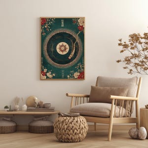 May include: A framed art print featuring a vintage-style record player design. The artwork has a teal background with floral accents in red and cream. The record player's center has a starburst design.