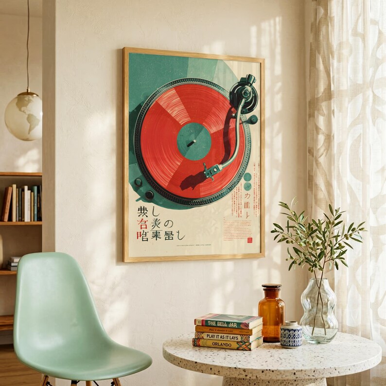 May include: A rectangular wall art print featuring a top-down illustration of a turntable with a vibrant red vinyl record. The background is a muted teal and cream color palette with Japanese text characters printed in black and red ink.