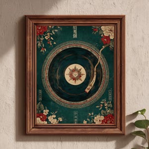 May include: A framed art print featuring a vintage-style illustration of a record player. The artwork has a teal background with floral accents in red and white. The record player's needle is positioned over the record. The frame is made of brown wood.