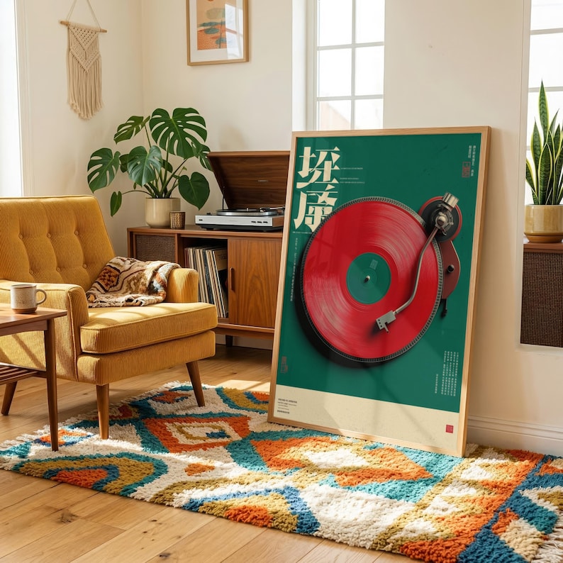 May include: A rectangular framed wall art print featuring a vibrant red vinyl record on a dark green background. The artwork includes stylized white text and a detailed illustration of a turntable tonearm resting on the record surface.