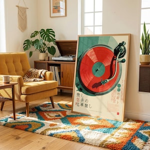 May include: A rectangular framed wall art print featuring a stylized illustration of a turntable with a vibrant red vinyl record. The design includes dark green circular accents and Japanese text characters printed in black, set against a cream background.