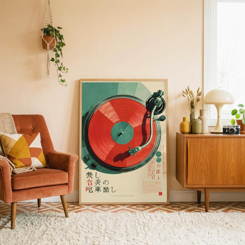 May include: A rectangular wall art print featuring a top-down illustration of a turntable with a vibrant red vinyl record. The design includes geometric teal accents and Japanese text characters printed in black at the bottom of the poster.