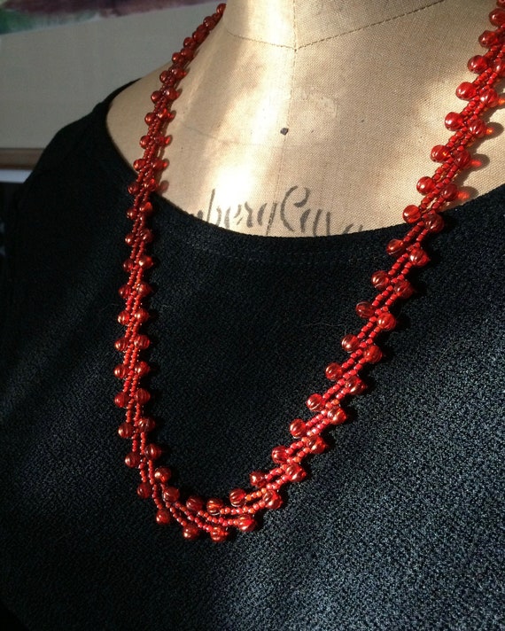 Long red best sale necklace