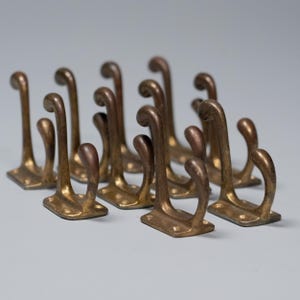 1910 Brass Coat Hooks