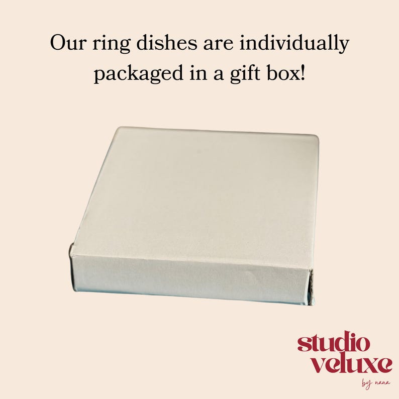 May include: A white ceramic mug with a black handle and the text "But First, Coffee" in a black, bold font. The mug is on a white surface. The mug is approximately 4 inches tall.