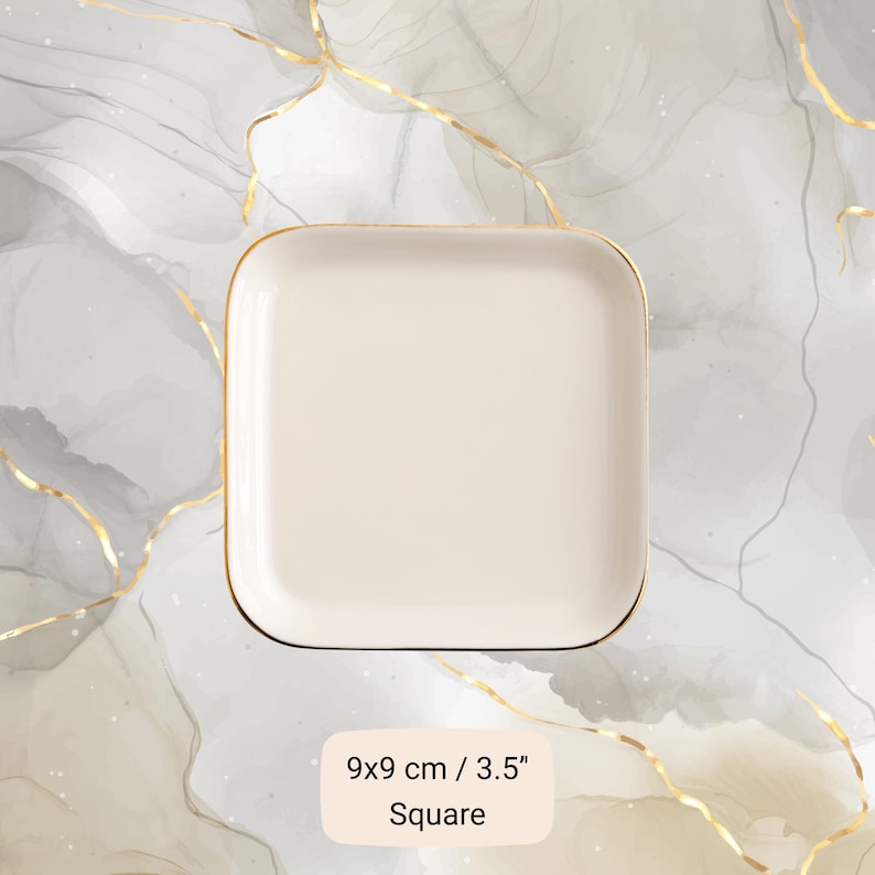 May include: A square, off-white ceramic plate with a gold rim. The plate measures 3.5 inches on each side. The text "Square" is below the measurement.