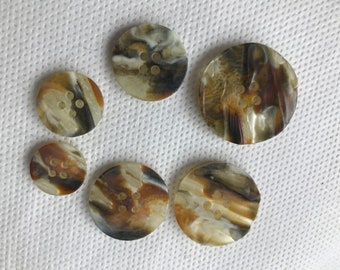 Textured 4 hole round back buttons - 6 sizes available - brown - orange - dark brown - pearlescent texturing.  Beautiful buttons.