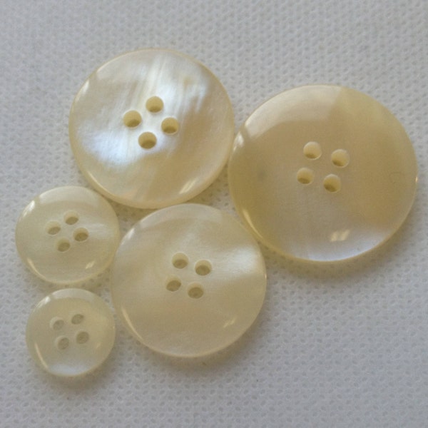 Ivory Pearlized  Buttons. 5 Sizes available, Beautiful 4 hole domed buttons, Lot size is 6 Buttons.