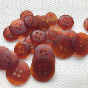 Amber Orange Satin 4 hole buttons,    Lot size is 6 buttons, 4 sizes available.