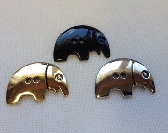 Elephant Button, 2 hole, Lot size is 8 buttons,  3 colors to choose from Gold  Black and Chrome  Size is 1 3/8" Wide by 7/8" tall.