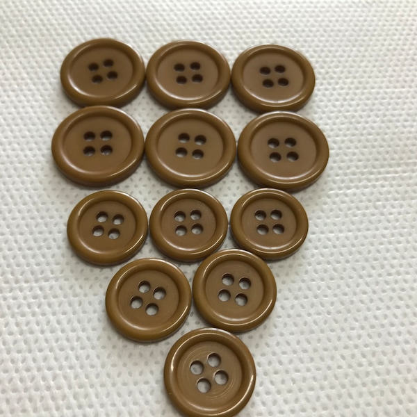 Mustard Brown Buttons with a rim  4 hole, Flat back  2 sizes available. 3/4"(19mm)  and 5/8"(15mm) in diameter .