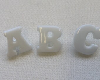 ABC Buttons. Lot size is  1A +1B + 1C.  White letters - Size is 1/2" x 1/2"ea letter. You will receive one of each Letter per lot purchased.