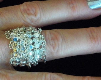 Anillo elástico con flecos de plata