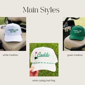 May include: Three baseball caps are displayed. Two caps feature the embroidered text 'a tradition unlike any other' in green on white and white on green. The third white cap features the word 'Caddie' with a red flag and green golf hole.